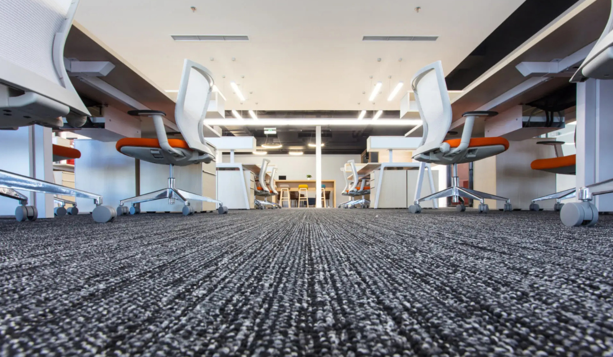 Modern office workspace with chairs and desks arranged neatly.
