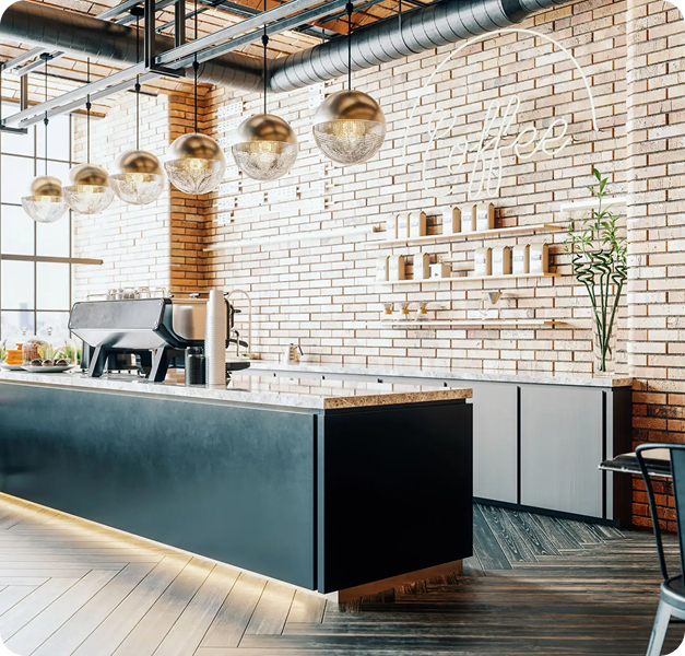 Modern kitchen with a large island and hanging pendant lights.