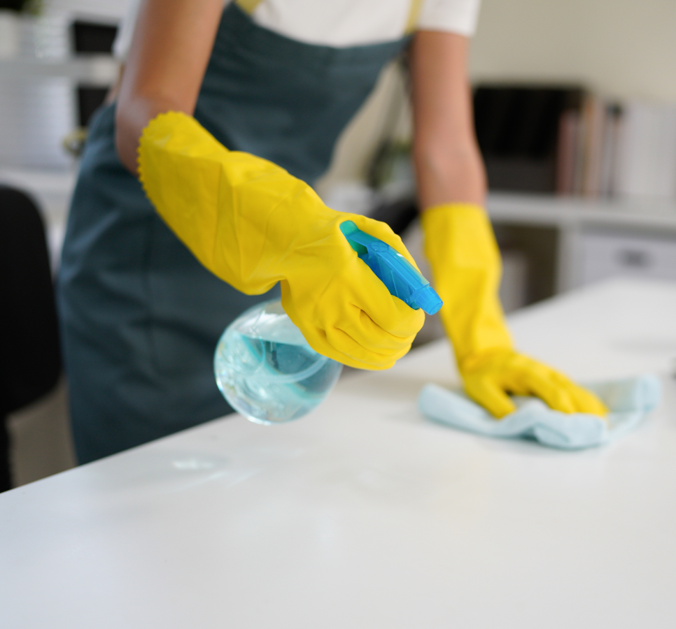 Cleaning table with spray bottle and cloth