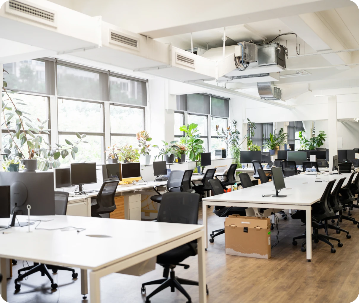 Empty modern office with computers and chairs.