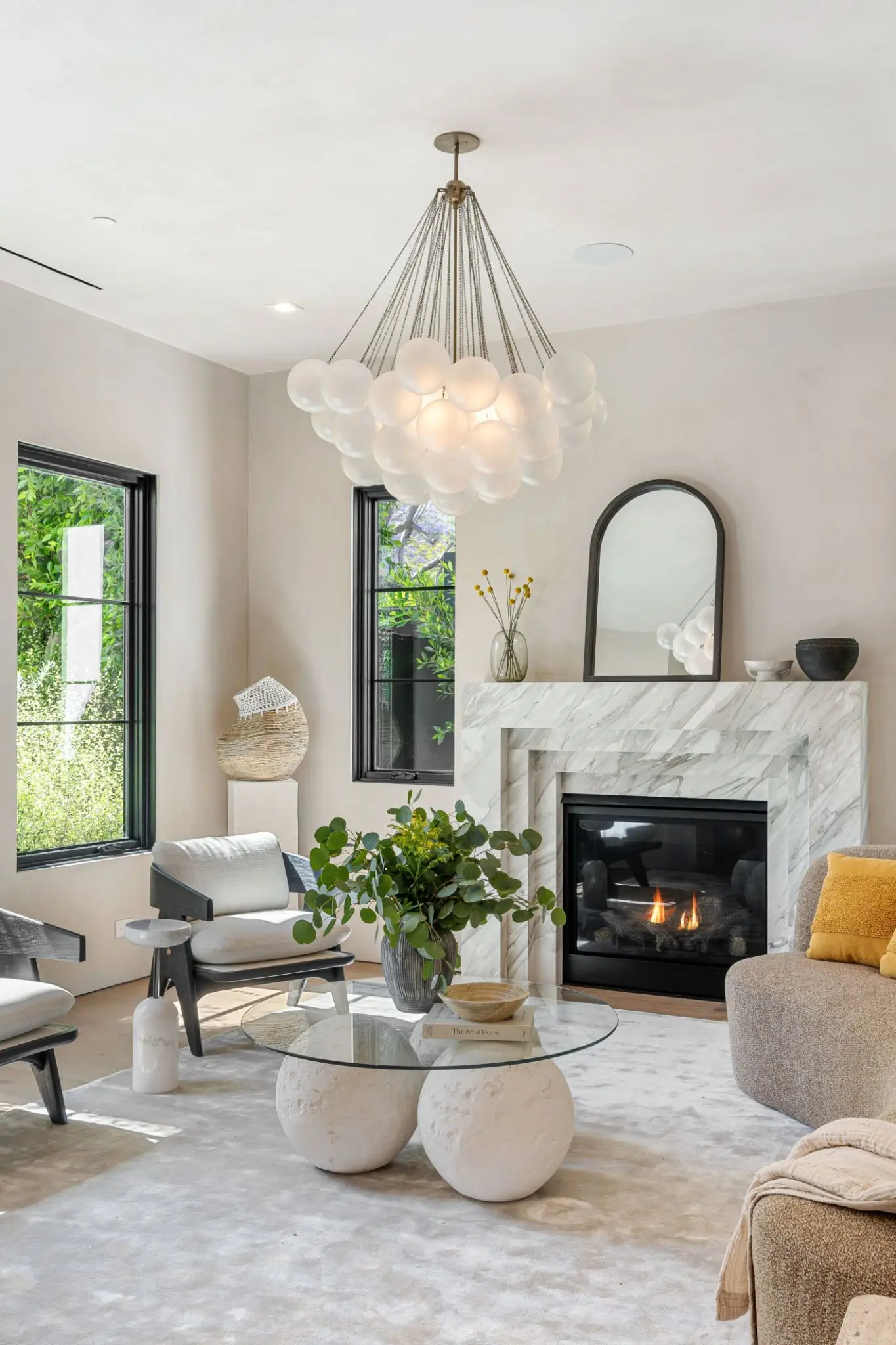 Cozy modern living room with a fireplace and stylish decor.